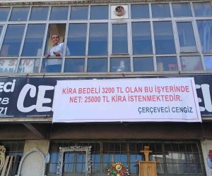 Kiraya yüzde 500 zam isteyen iş yeri sahibine dükkana astığı pankartla isyan etti