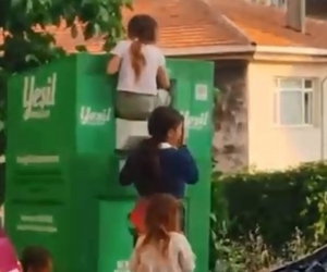 Canlarını hiçe sayarak giysi kumbarasından kıyafet çaldılar